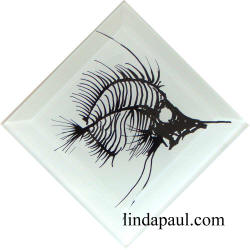 white and black fish fossil tile