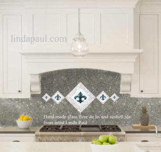 5 fleur de lis glass tile acscent in mother of pearl and antracite terazzo backsplash