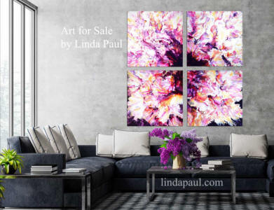 grey living room with 4 abstract art paintings