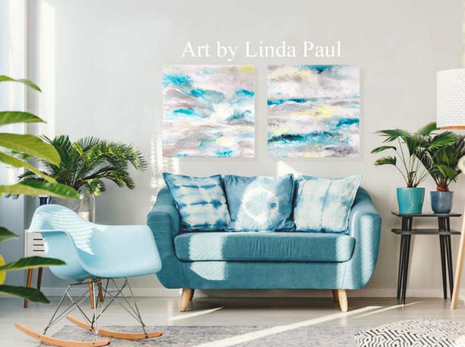 living room with blue sofa and abstract ocean art
