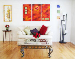 red painitng over sofa